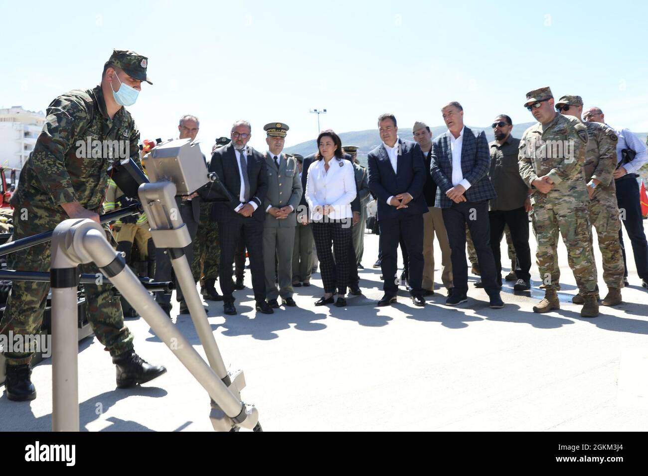 The Albanian Armed Forces Explosive Ordnance Disposal (EOD) unit shows off U.S. donated equipment , including robots designed to move explosive devices and keep military personnel safely out of harm's way May 22, 2021, at a military sponsored open house in Vlore, Albania, held as part of DEFENDER-Europe 21 activities.  During the event, U.S. Ambassador to Albania Yuri Kim was briefed on the equipment and the continued U.S. commitment to peace and security in Albania, which includes decontamination of landmine and unexploded ordnance sites left over from previous conflict here. DEFENDER-Europe Stock Photo
