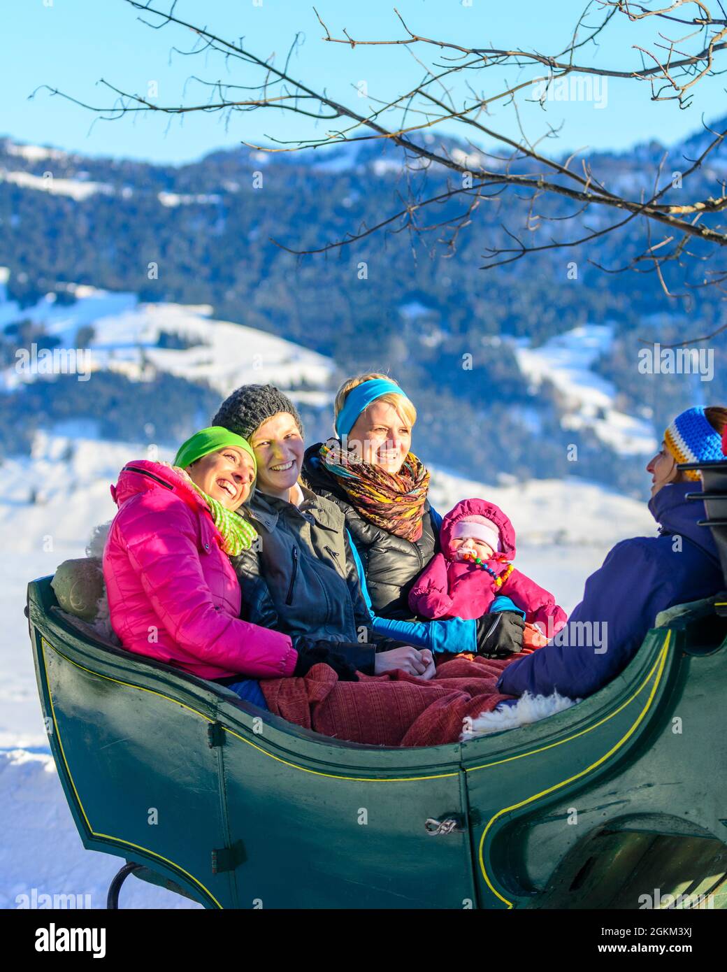 Enjoy your winter holiday on a horse-drawn sleigh ride in the snow-covered Bregenz Forest Stock Photo