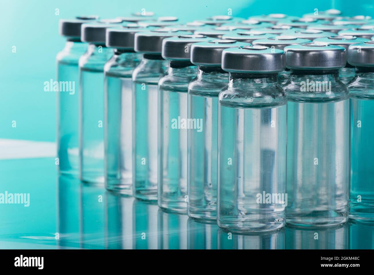 Glass medical ampoule vial for injection. Medicine is liquid sodium