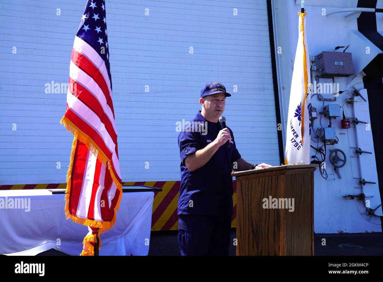 Capt. Stephen Adler, commanding officer of the Coast Guard Cutter Stratton (WMSL 752), speaks to the crew during Stratton’s change of command ceremony held aboard while anchored in the San Francisco Bay, May 22, 2021. Adler relieved Capt. Bob Little as Stratton’s commanding officer during the at-sea ceremony. Stock Photo