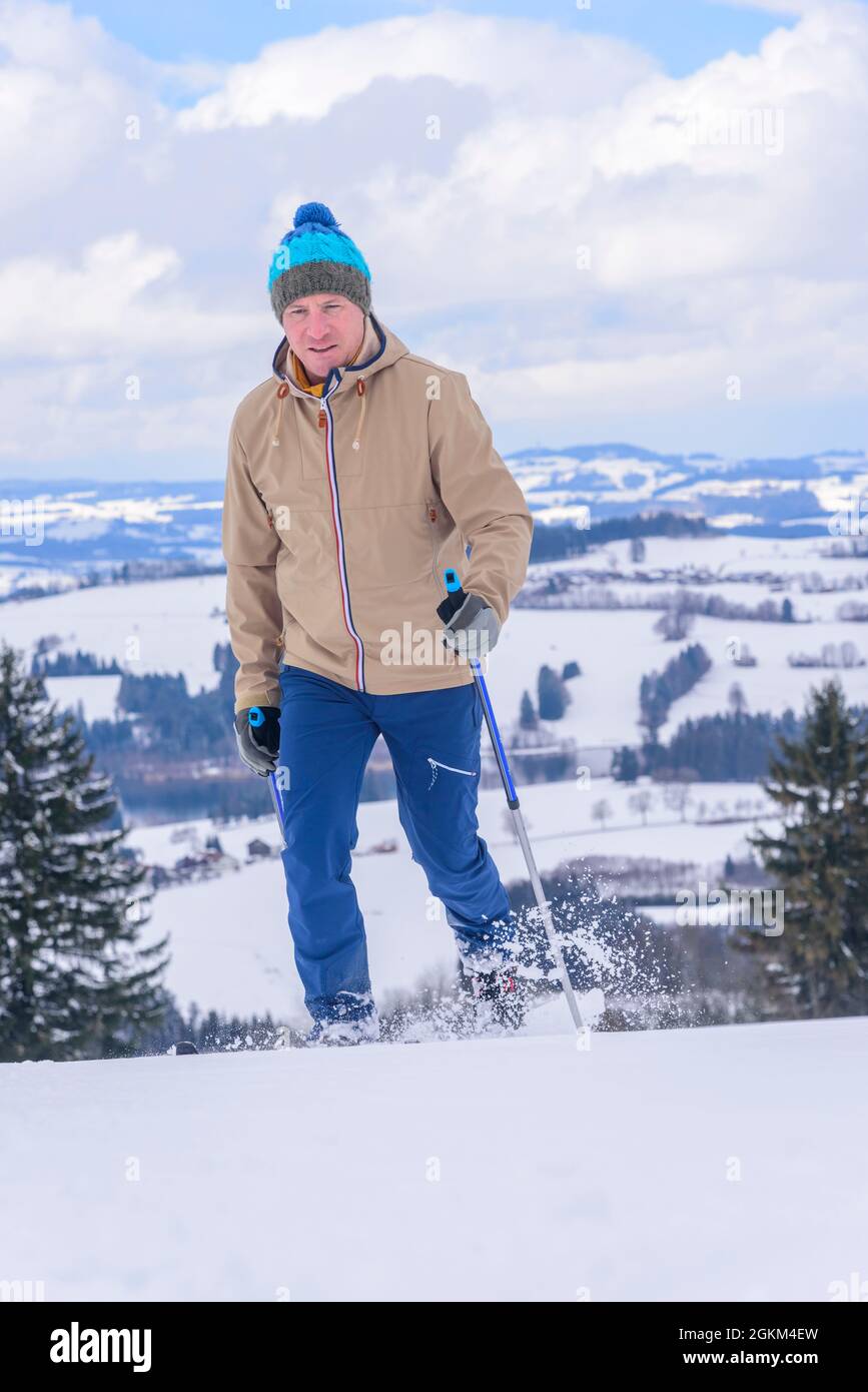 Man doing a winter walk with Nordic Cruising Equipment Stock Photo