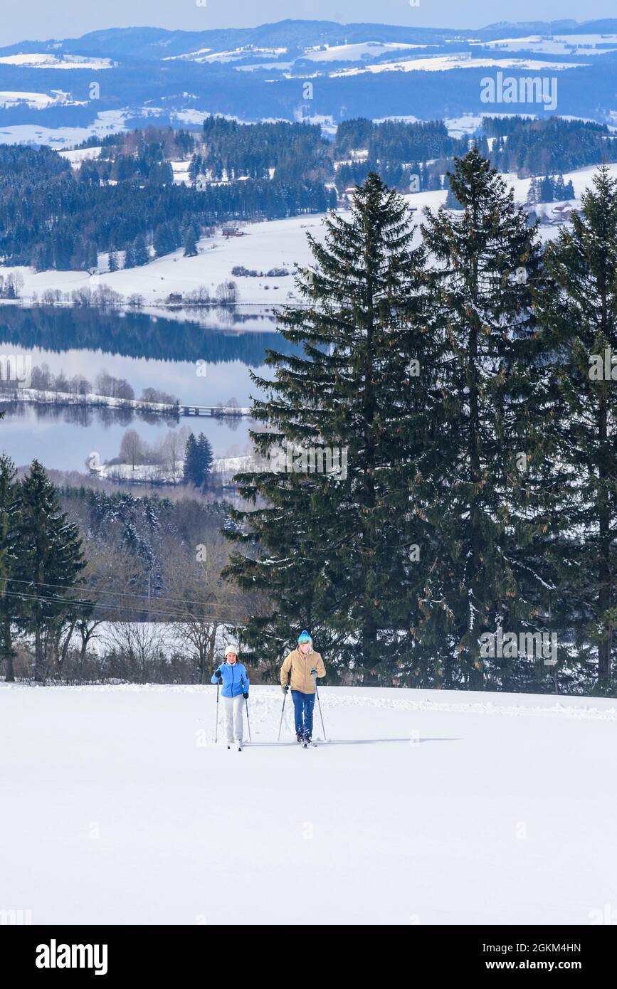 Couple doing a winter walk with Nordic Cruising Equipment Stock Photo
