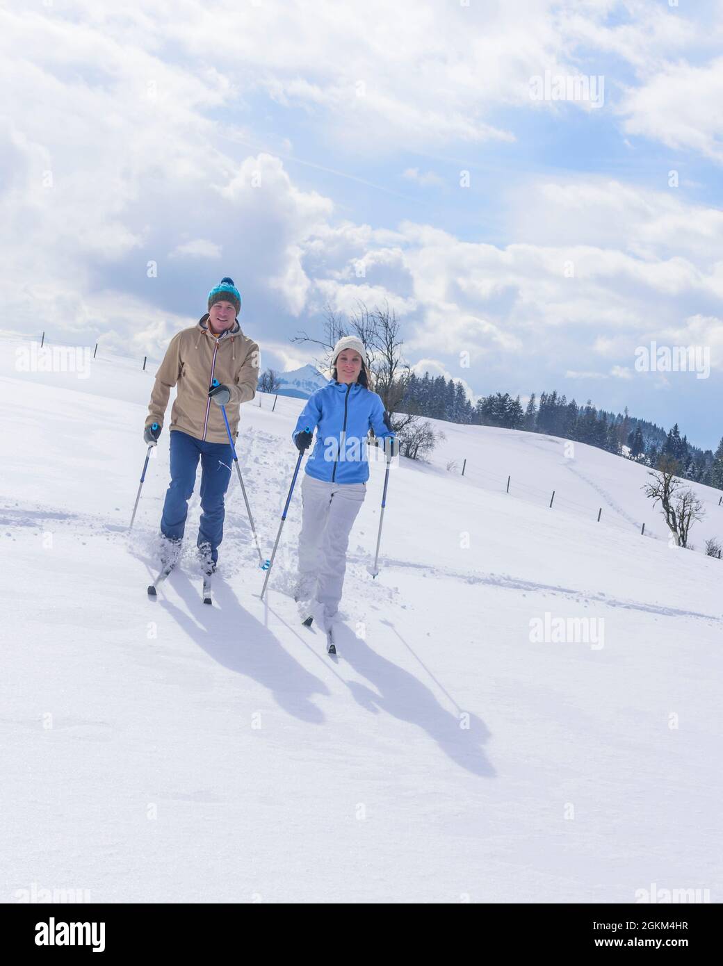 Couple doing a winter walk with Nordic Cruising Equipment Stock Photo