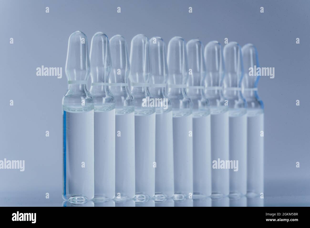 Glass medical ampoule vial for injection. Medicine is dry white drug ...