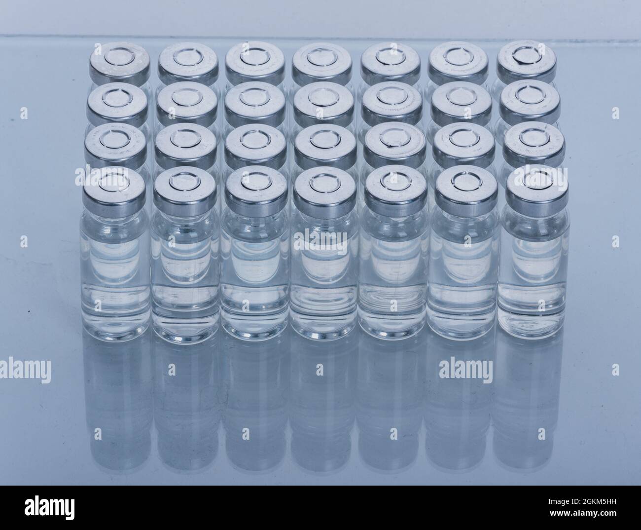Glass medical ampoule vial for injection. Medicine is dry white drug ...