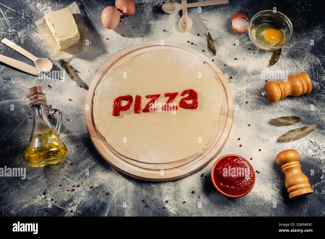 Preparing homemade Italian pizza with a newly rolled dough base