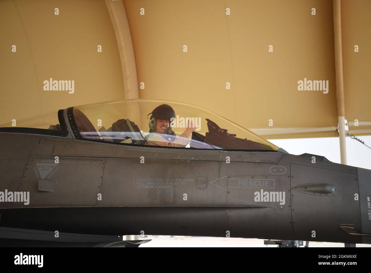 Lt. Col. Zachary Counts, 157th Expeditionary Fighter Squadron pilot, returns from a flight aboard an F-16 Fighting Falcon fighter jet at Prince Sultan Air Base, Kingdom of Saudi Arabia, May 23, 2021. The 'Swamp Fox' airmen from the South Carolina Air National Guard are deployed to PSAB to project combat power and help bolster defensive capabilities against potential threats in the region. Stock Photo