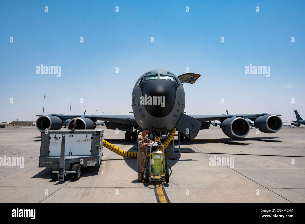 A U.S. Air Force KC-135R Stratotanker aircraft pilot assigned to the 340th Expeditionary Air Refueling Squadron reviews a maintenance book prior to an operation backing the Resolute Support Mission in Afghanistan at Al Udeid Air Base, Qatar, May 23, 2021. The 340th EARS, deployed under U.S. Air Forces Central, is responsible for delivering fuel to U.S. and partner nations, enabling airpower, deterrence, and stability to the region. Stock Photo