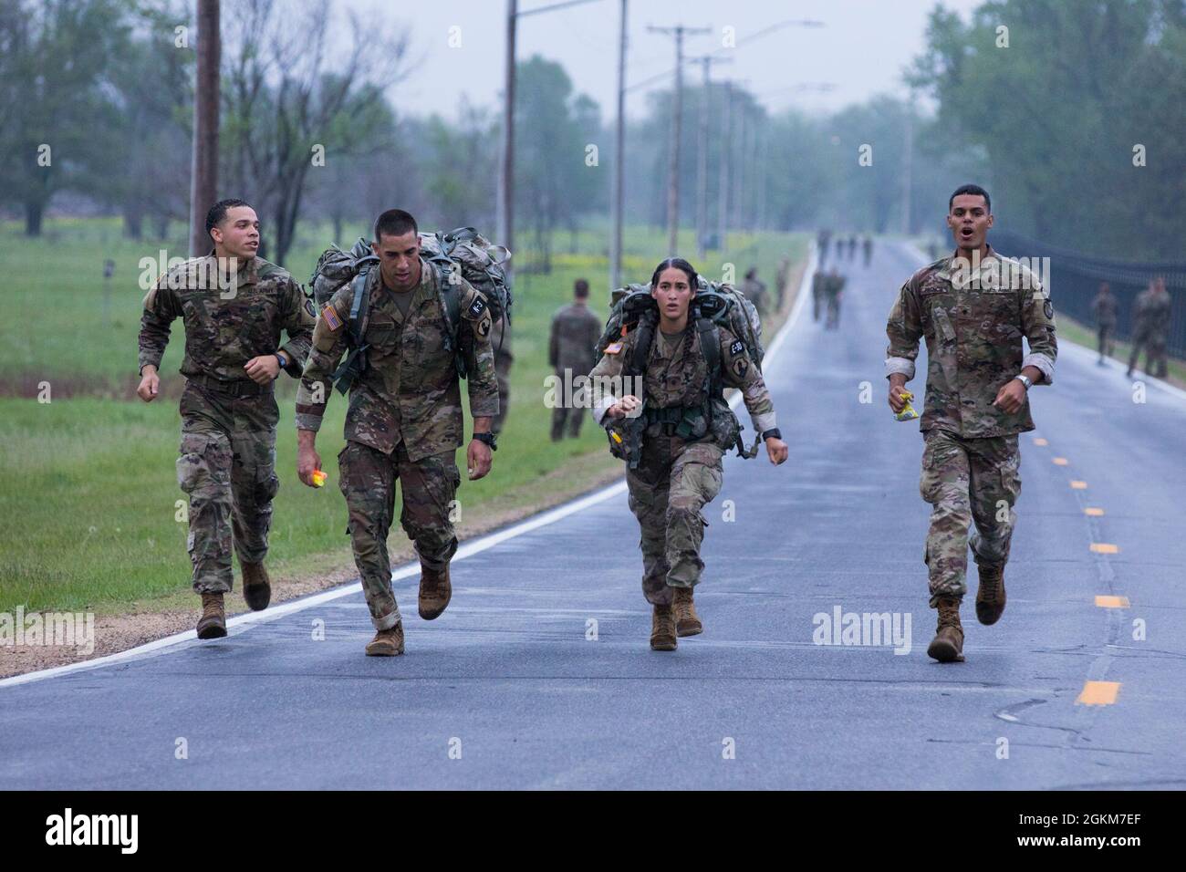 Members of Squad 5 rally teammates to complete the 12 mile ruck march ...