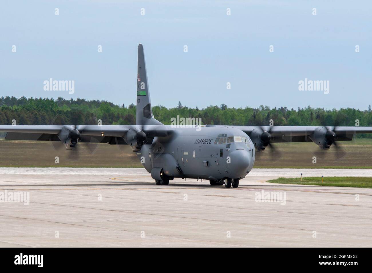 A C-130J Super Hercules taxis after landing at Alpena Combat Readiness Training Center, Michigan, May 24, 2021, in support of Exercise Mobility Guardian 2021. The C-130 contained an Aerial Bulk Fuel Delivery System, a portable 3,000-gallon fuel bladder, can be loaded on a C-130J Super Hercules, C-5 Galaxy, or C-17 Globemaster III and transported anywhere around the world. Stock Photo