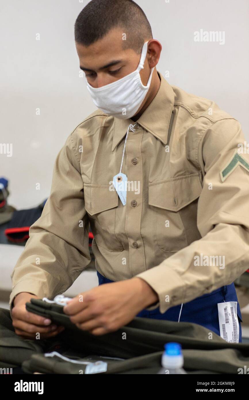 Recruit Albert Salomon with India Company, 3rd Recruit Training Battalion,  gets his uniform tailored during their second uniform fitting at Marine  Corps Recruit Depot, San Diego, California, May 24, 2021. Salomon was
