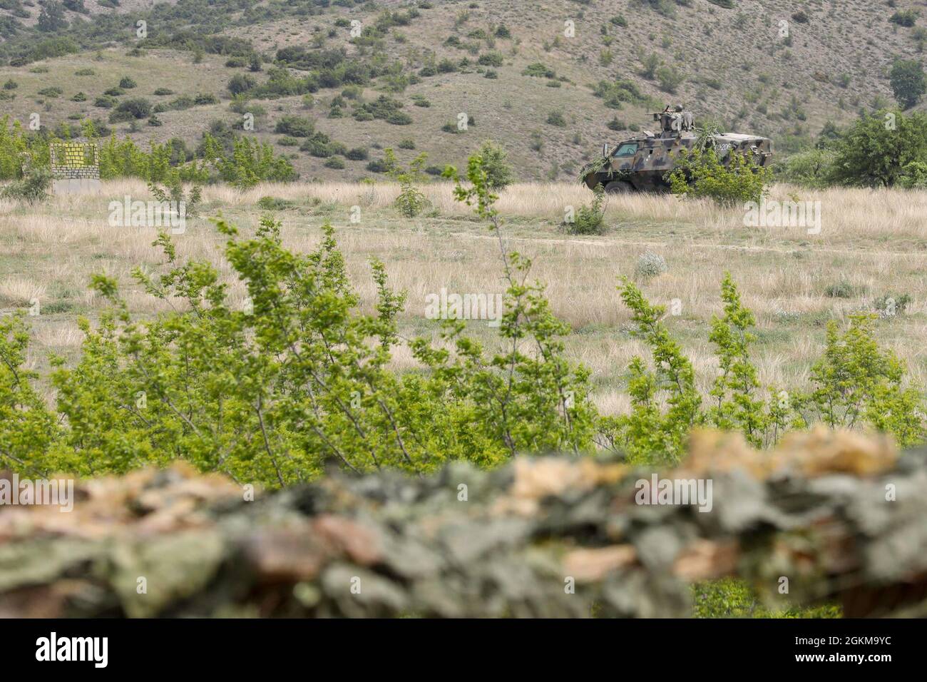 Army of the Republic of North Macedonia Soldiers await orders to conduct a company live fire exercise in Krivolak Training area, North Macedonia, May 25, 2021. All Soldiers shown are fully vaccinated and tested negative for COVID-19. DEFENDER-Europe 21 is a large-scale U.S. Army-led exercise designed to build readiness and interoperability between the U.S., NATO allies and partner militaries. This year, more than 28,000 multinational forces from 26 nations will conduct nearly simultaneous operations across more than 30 training areas in more than a dozen countries from the Baltics to the strat Stock Photo