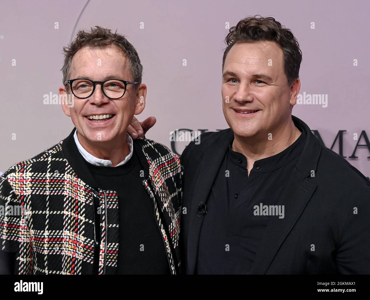 Berlin, Germany. 14th Sep, 2021. Frank Mutters (l) and his husband Guido Maria Kretschmer arrive at the Kraftwerk for Guido Maria Kretschmer's fashion show as part of the About You Fashion Week. About You, or Re-Fashion Week, has been part of Berlin Fashion Week since 2021. About You Fashion Week runs from 11 to 15 September 2021. Credit: Jens Kalaene/dpa-Zentralbild/dpa/Alamy Live News Stock Photo