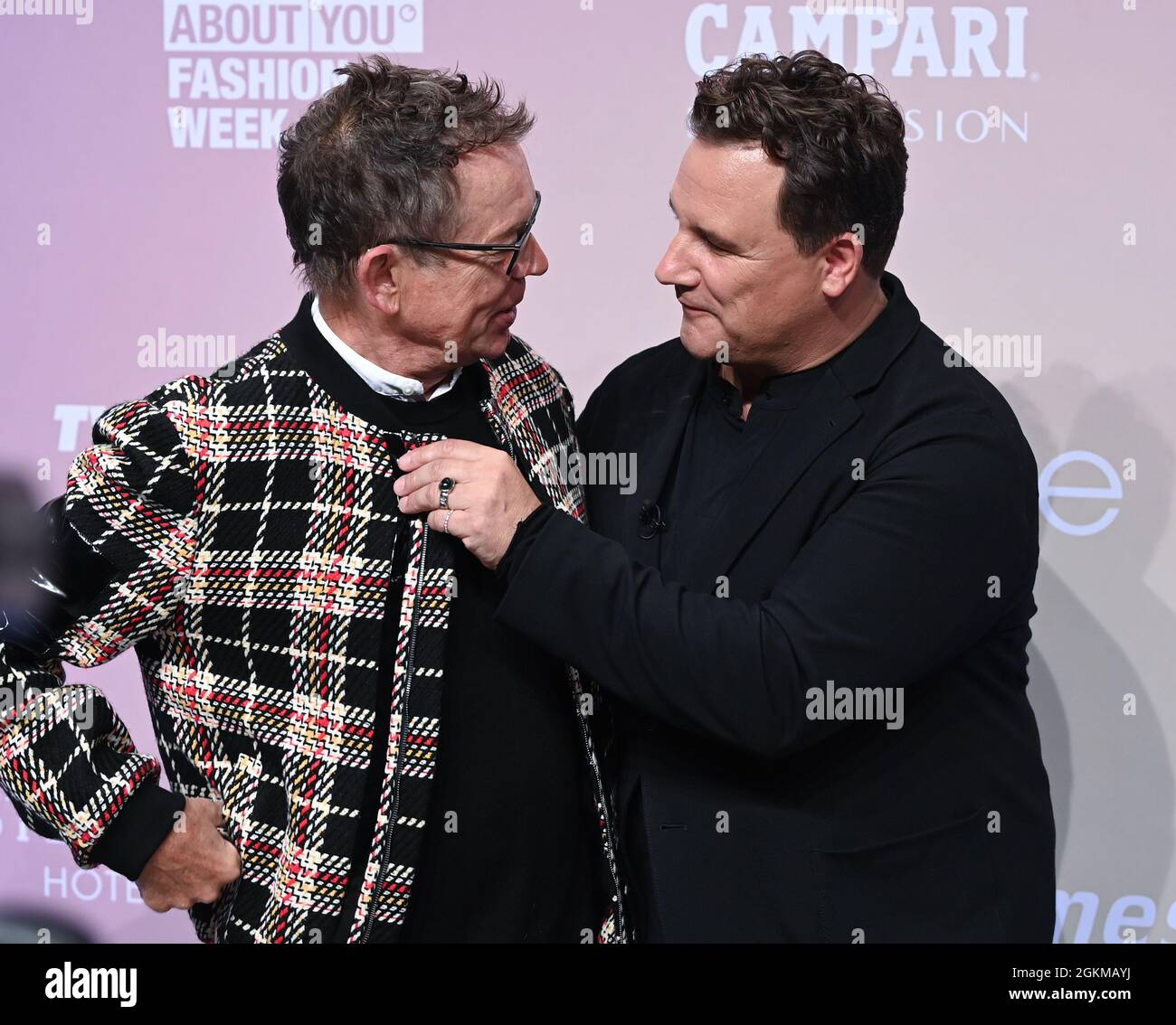 Berlin, Germany. 14th Sep, 2021. Frank Mutters (l) and his husband Guido Maria Kretschmer arrive at the Kraftwerk for Guido Maria Kretschmer's fashion show as part of the About You Fashion Week. About You, or Re-Fashion Week, has been part of Berlin Fashion Week since 2021. About You Fashion Week runs from 11 to 15 September 2021. Credit: Jens Kalaene/dpa-Zentralbild/dpa/Alamy Live News Stock Photo