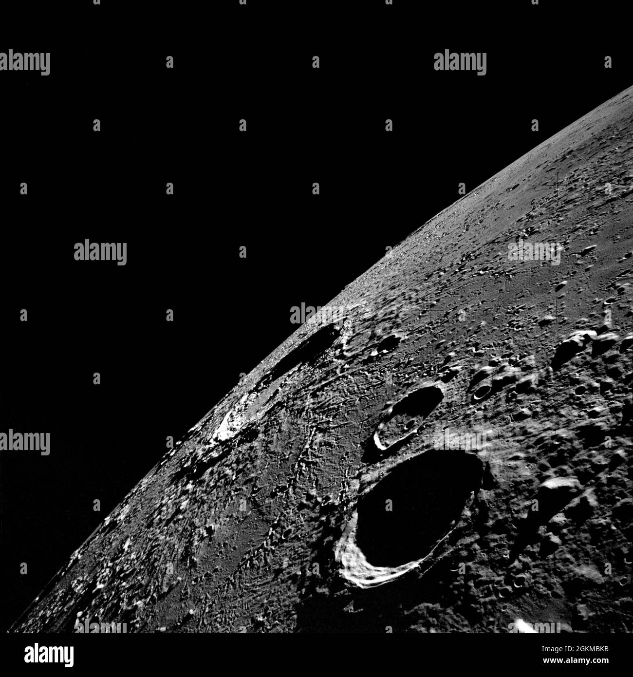 (November 1969) --- An Apollo 12 high-oblique view of the lunar nearside looking northeast toward the crater Copernicus (in center near horizon), as photographed from lunar orbit. The shaded crater in the foreground is Reinhold. Reinhold B is the crater next to Reinhold which as the small crater in the center of it. Also, visible is the keyhole-shaped crater Fauth near the crater Copernicus. Stock Photo