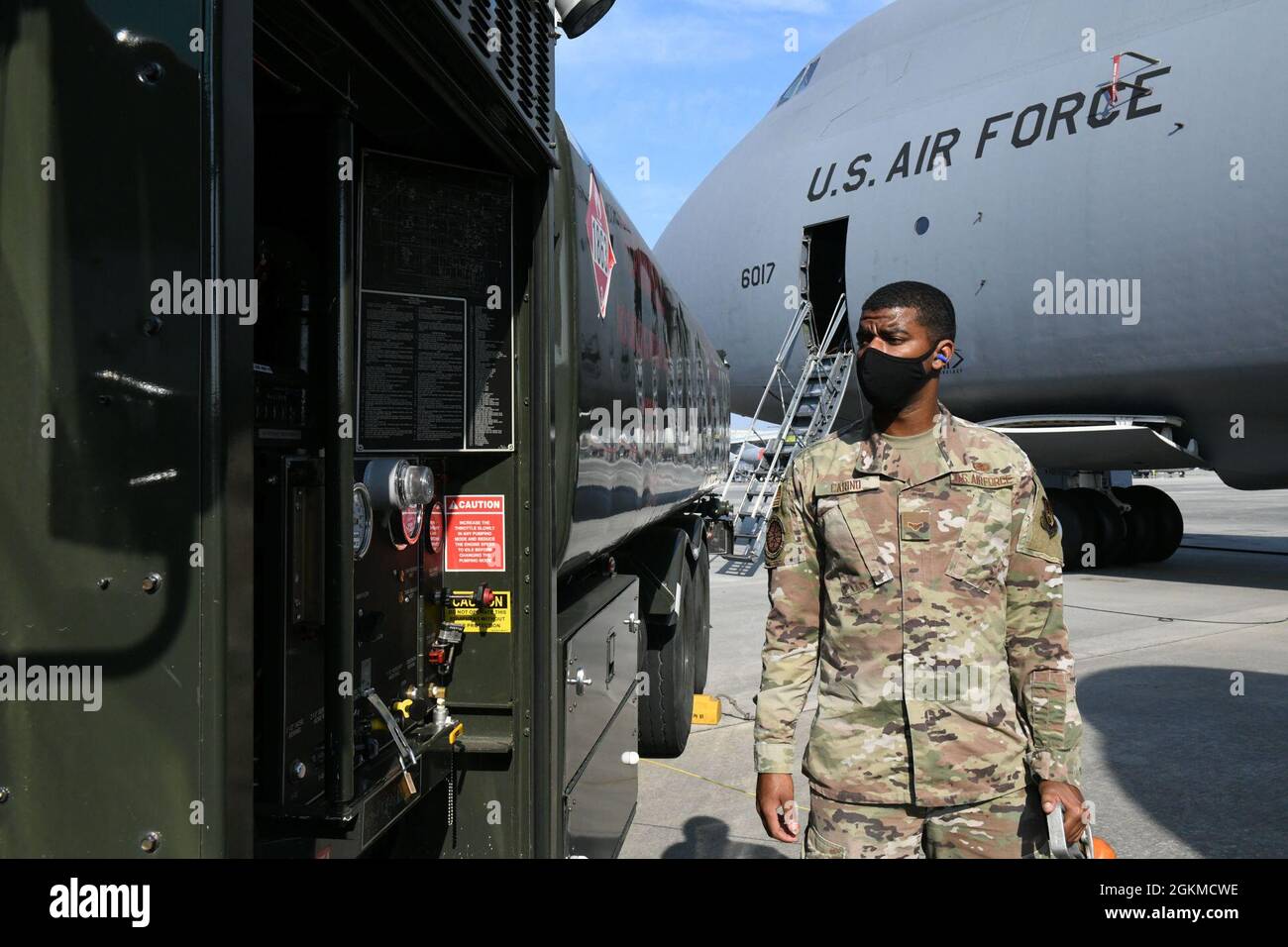 Airman 1st Class Deshawn Carino, 78th Logistics Readiness Squadron Fuels Management Flight Distribution Element distribution operator, monitors the R-11 trucks instruments during defuel operations of a C-5 Galaxy at Robins Air Force Base, Georgia, May 25, 2021. Once the trucks capacity reaches 5,000 gallon an additional person is needed on top of the truck to ensure fuel does not over fill the tank. Stock Photo