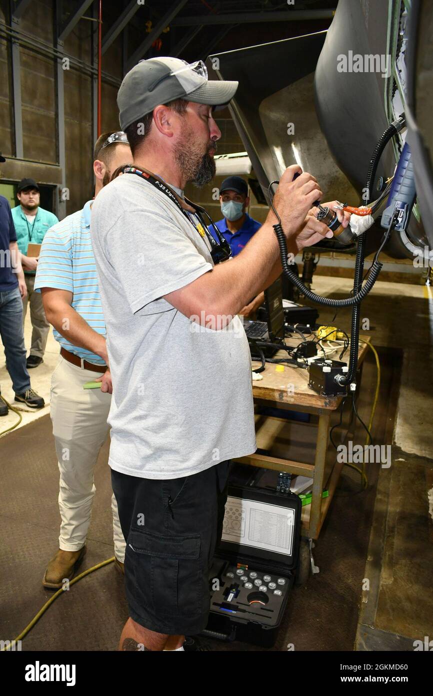 John Blumling, FRCE F35 electrical work lead, demonstrates FRCE’s