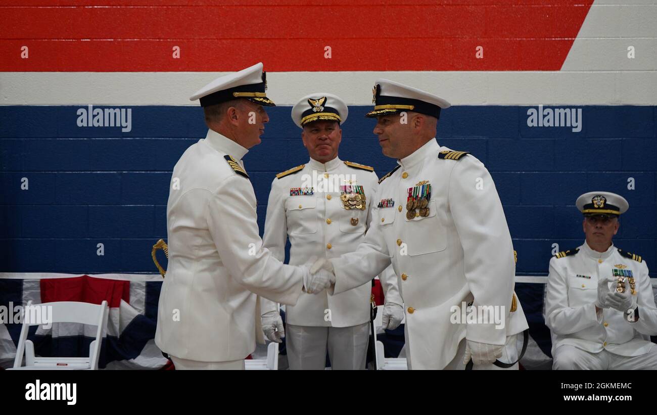 Capt. John Dewey relieved Capt. Michael Roschel as commanding officer of Coast Guard Base Portsmouth in a change of command ceremony at Base Portsmouth on Wednesday, May 26, 2021, that was presided over by the Director of Operational Logistics Rear Adm. Melvin Bouboulis. Stock Photo
