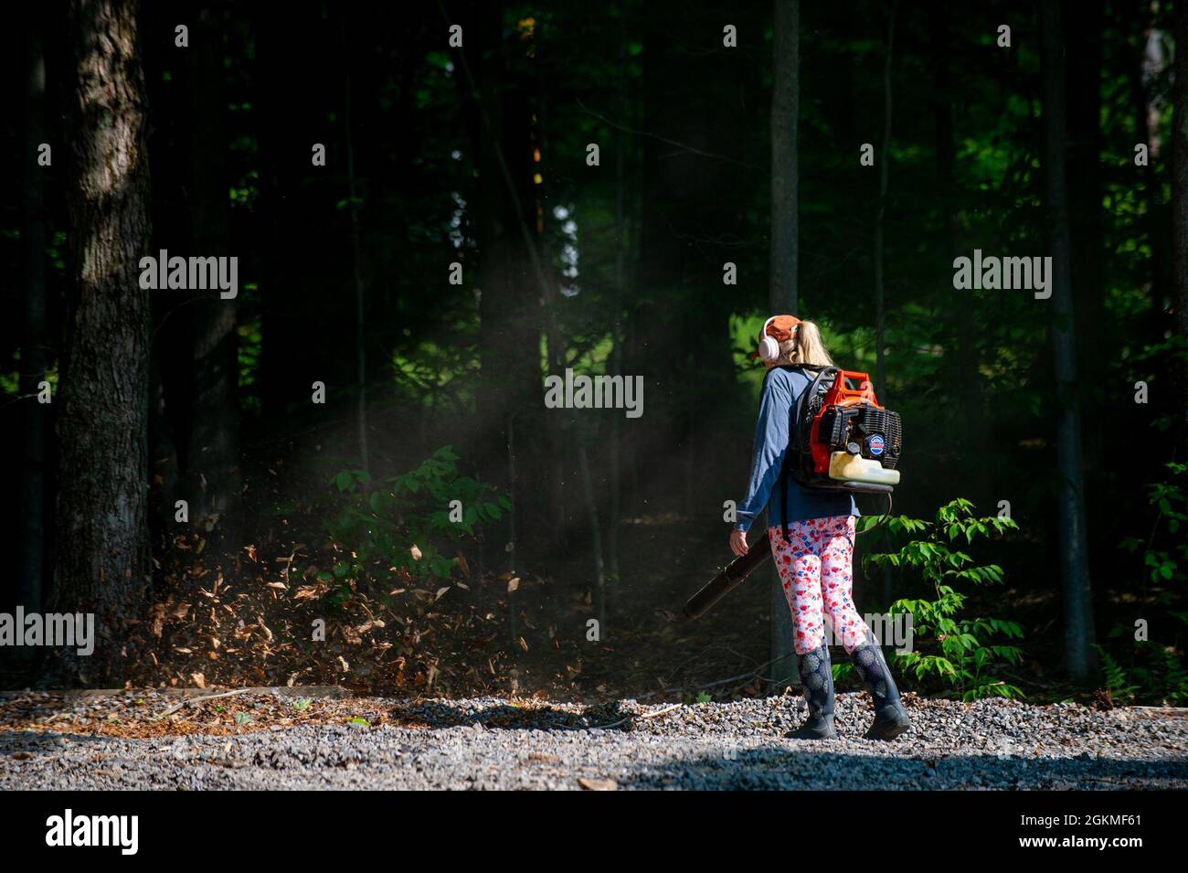A campground volunteer blows leaves at the East Branch Clarion River