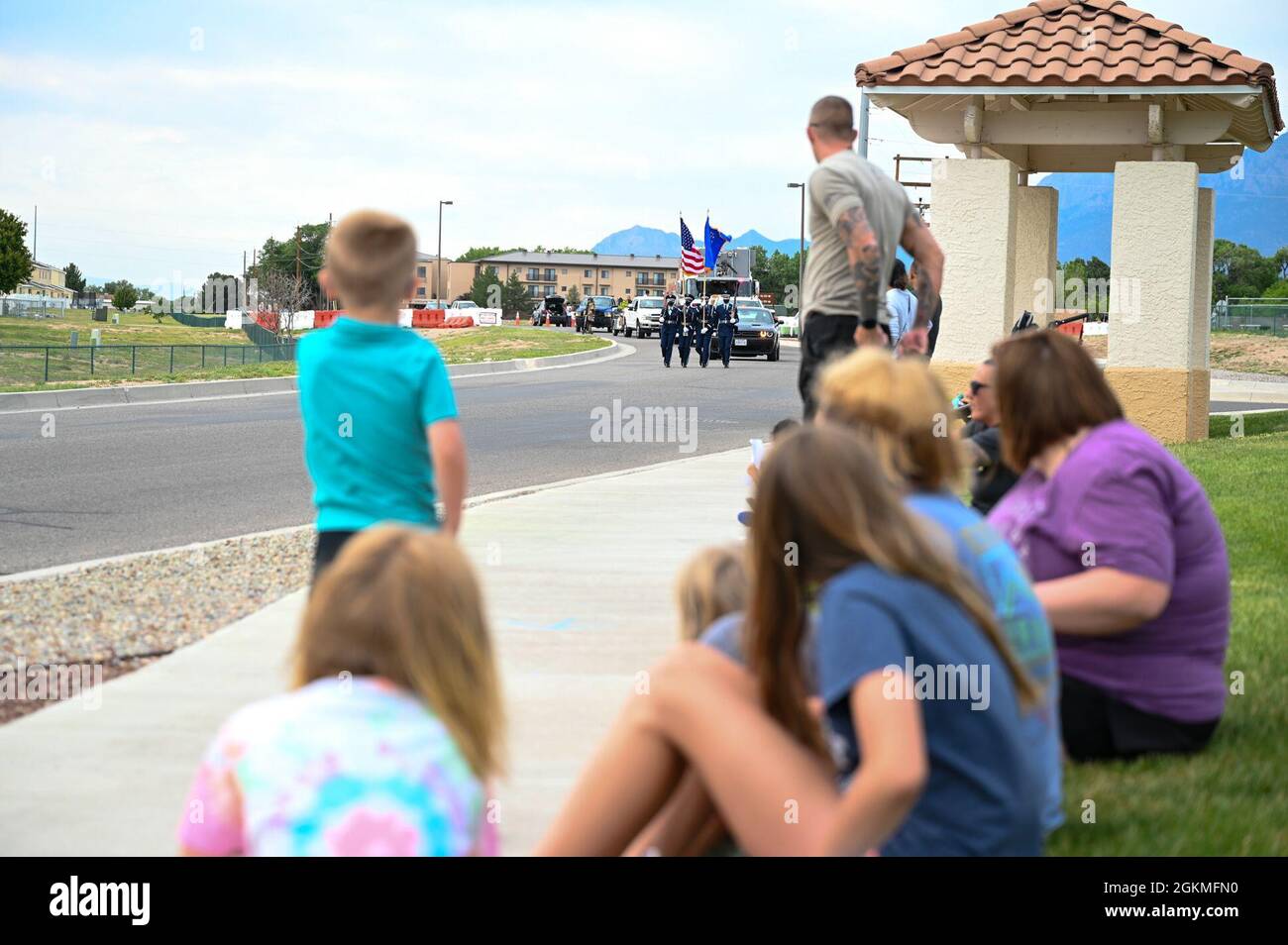 Team Kirtland families watch a graduation parade at Kirtland Air Force
