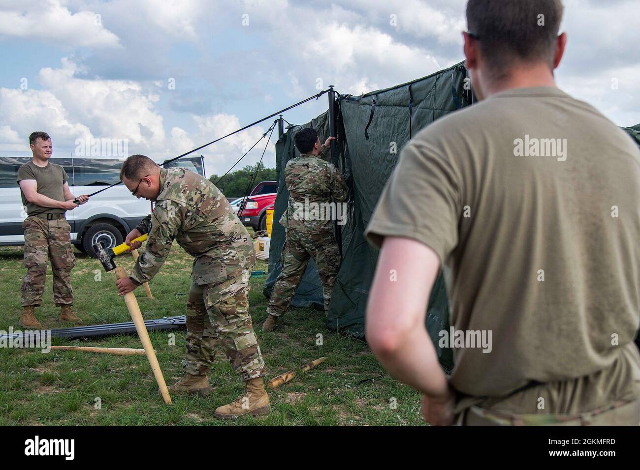 Members of the 470 Military Intelligence Brigade set up tents prior to the  Norwegian Foot March event, May 26, 2021, at Camp Bullis, Texas. The  Norwegian Foot March, originated during the WWII