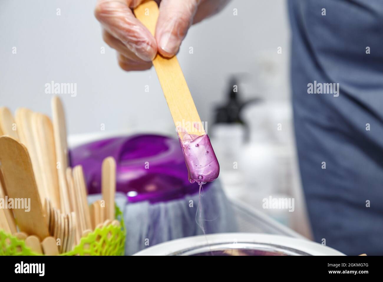 Wax on the wooden stick for depilation Stock Photo