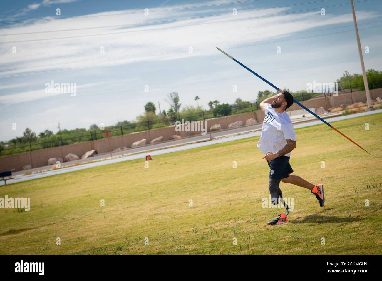 Retired U.S. Army Sgt. Michael Gallardo throws a javelin during the