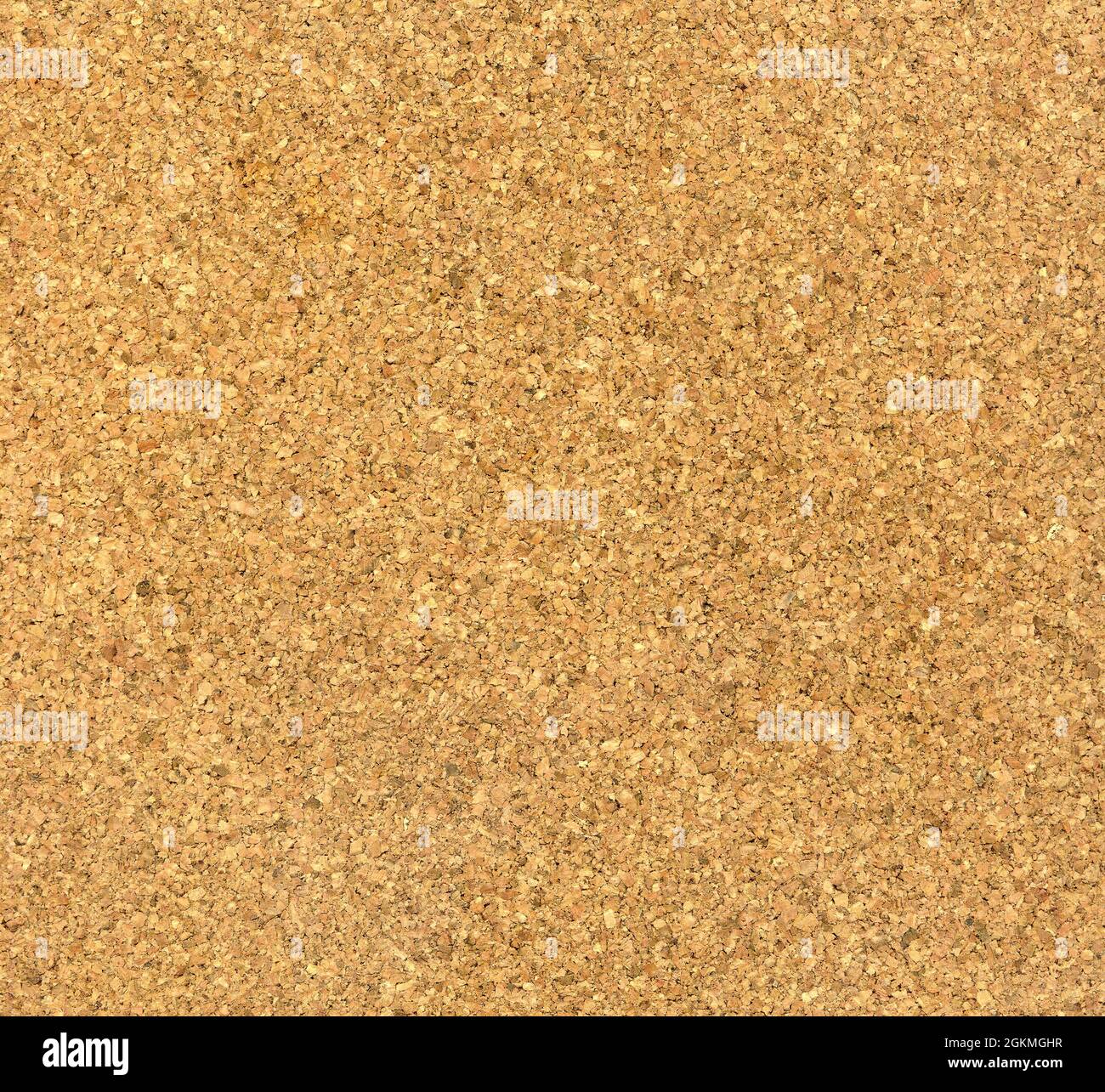 Brown cork board blank background texture closeup. Stock Photo