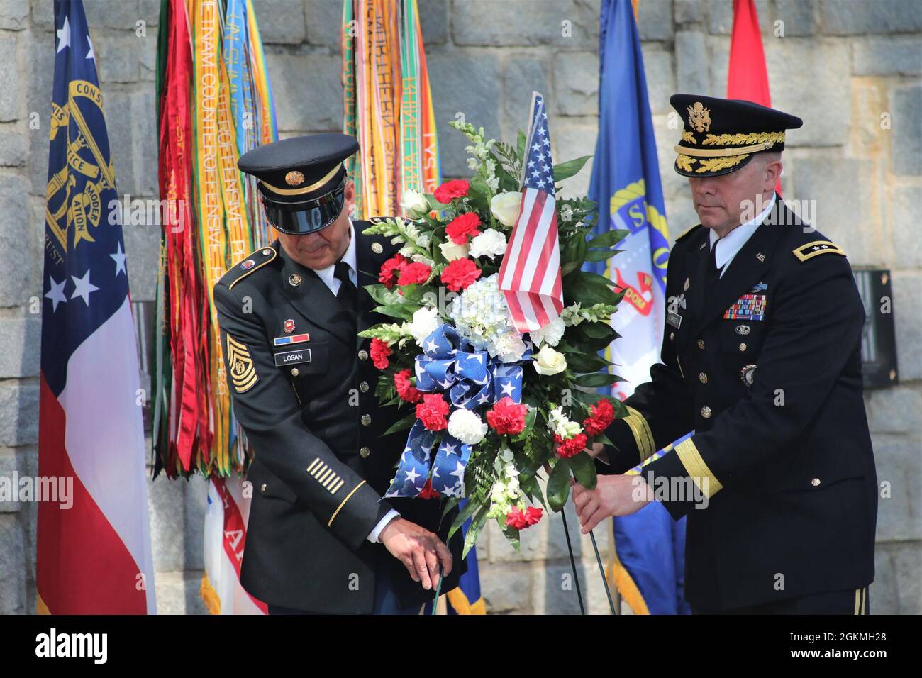U.S. Army Maj. Gen. Thomas Carden (right), The Adjutant General of Georgia, and Command Sgt. Maj. Jeff Logan (left), the state command sergeant major of the Georgia Army National Guard, lay a wreath before the Georgia National Guard memorial wall May 27, 2021, during a Memorial Day Observation Ceremony at Clay National Guard Center in Marietta, Georgia. The wall is dedicated to the memory of 43 Georgia Army National Guard Soldiers who have fallen since September 11, 2001. Stock Photo