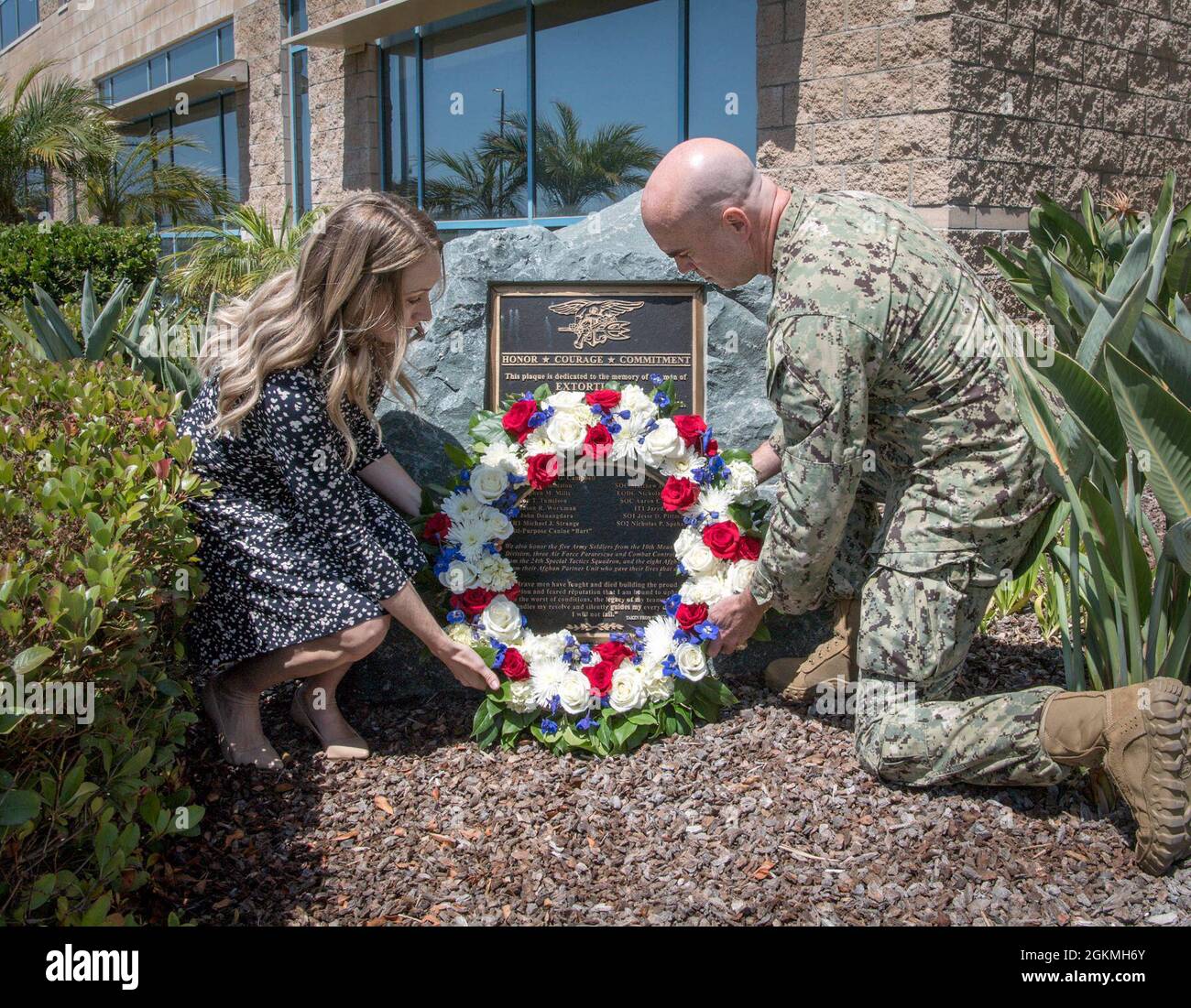 SAN DIEGO (May 27, 2021) Rear Adm. H.W. Howard III, Commander, Naval Special Warfare Command and his wife Sarah lay a wreath in observance of Memorial Day on the Extortion 17 Memorial. The Extortion 17 helicopter crash claimed the lives of 38 people, including 22 NSW personnel in Afghanistan Aug. 6, 2011. NSW is the nation’s premiere maritime special operations force that extends the Fleet and Joint Force's reach for collection and lethality, delivers all domain options to undermine our enemies’ confidence, and strengthens diplomatic leverage. Stock Photo