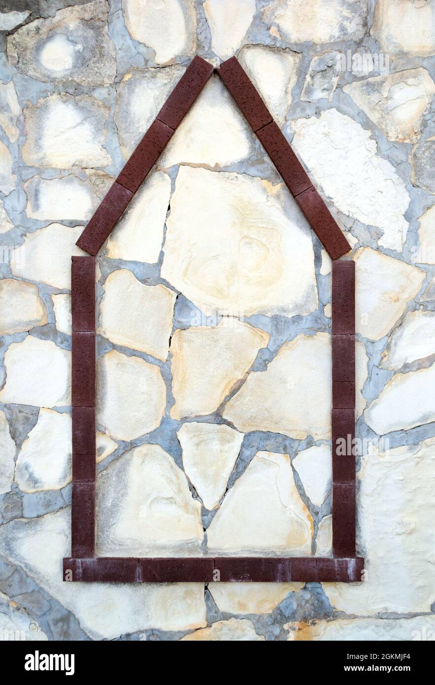 House icon from wood on stone background, home construction concept Stock Photo