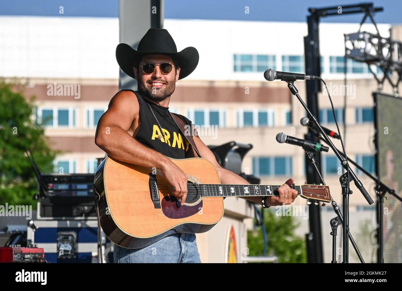 Austin Moody performs for service members and their families at Joint Base Langley-Eustis, Virginia, May 27, 2021. At the end of the performance, Moody was coined by U.S. Army Col. Chelsy Thigpen, 733rd Mission Support Group commander. Stock Photo