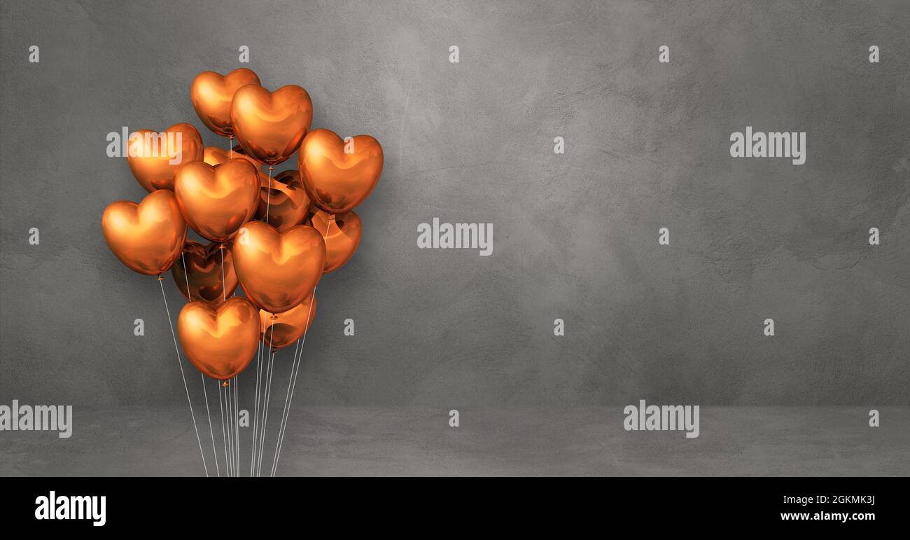 Copper heart shape balloons bunch on a grey wall background. Horizontal ...