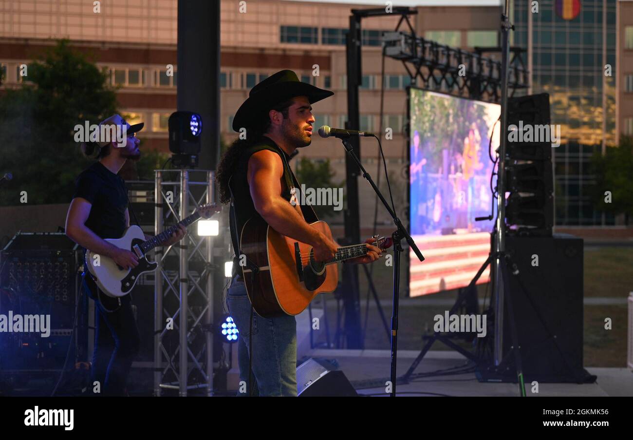 Austin Moody performs for service members and their families at Joint Base Langley-Eustis, Virginia, May 27, 2021. Moody grew up in Kingsport, Tennessee and was a junior reserve officer training corps student in high school. Stock Photo