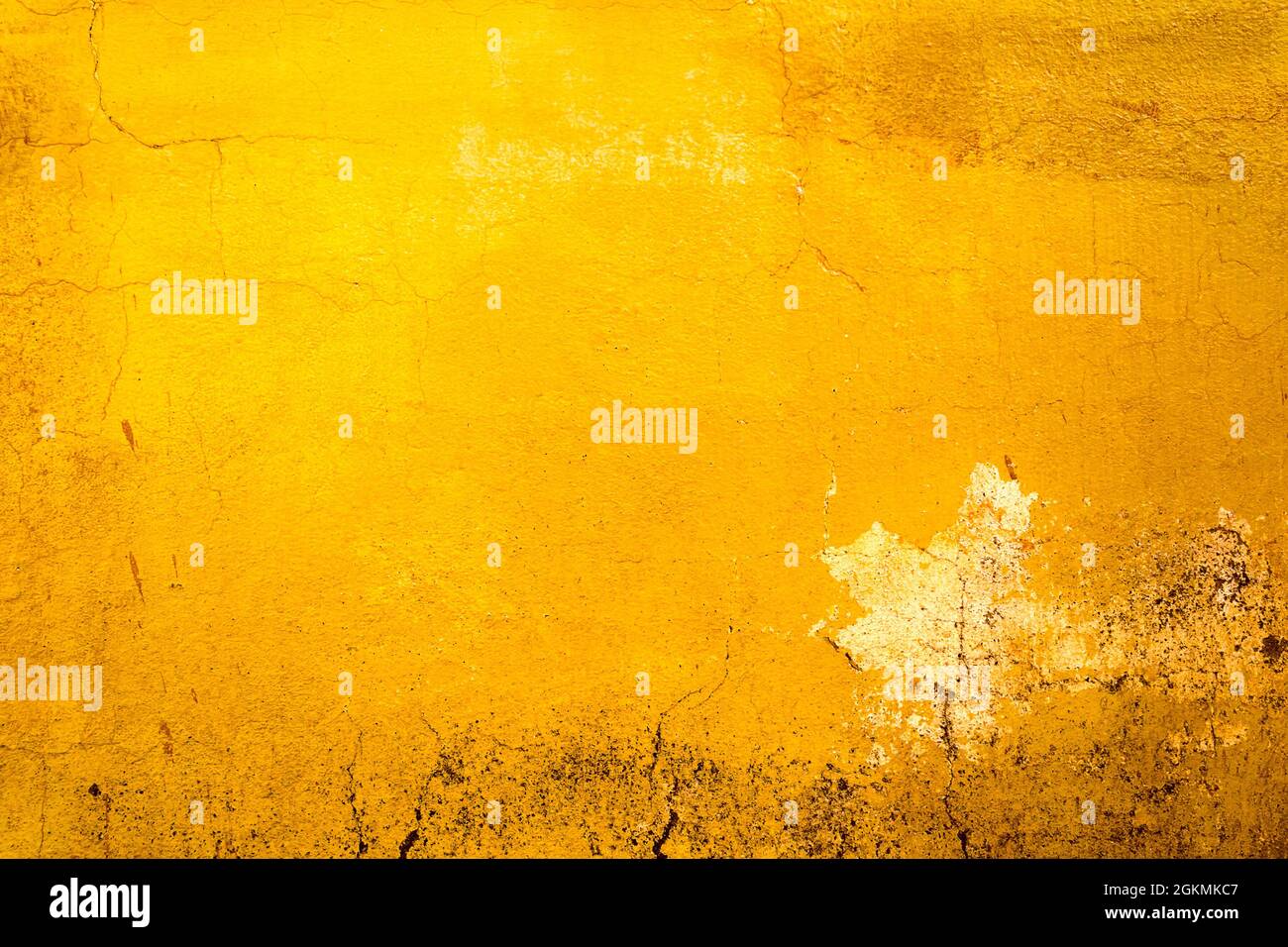 Yellow painted old dirty concrete wall texture or background Stock Photo