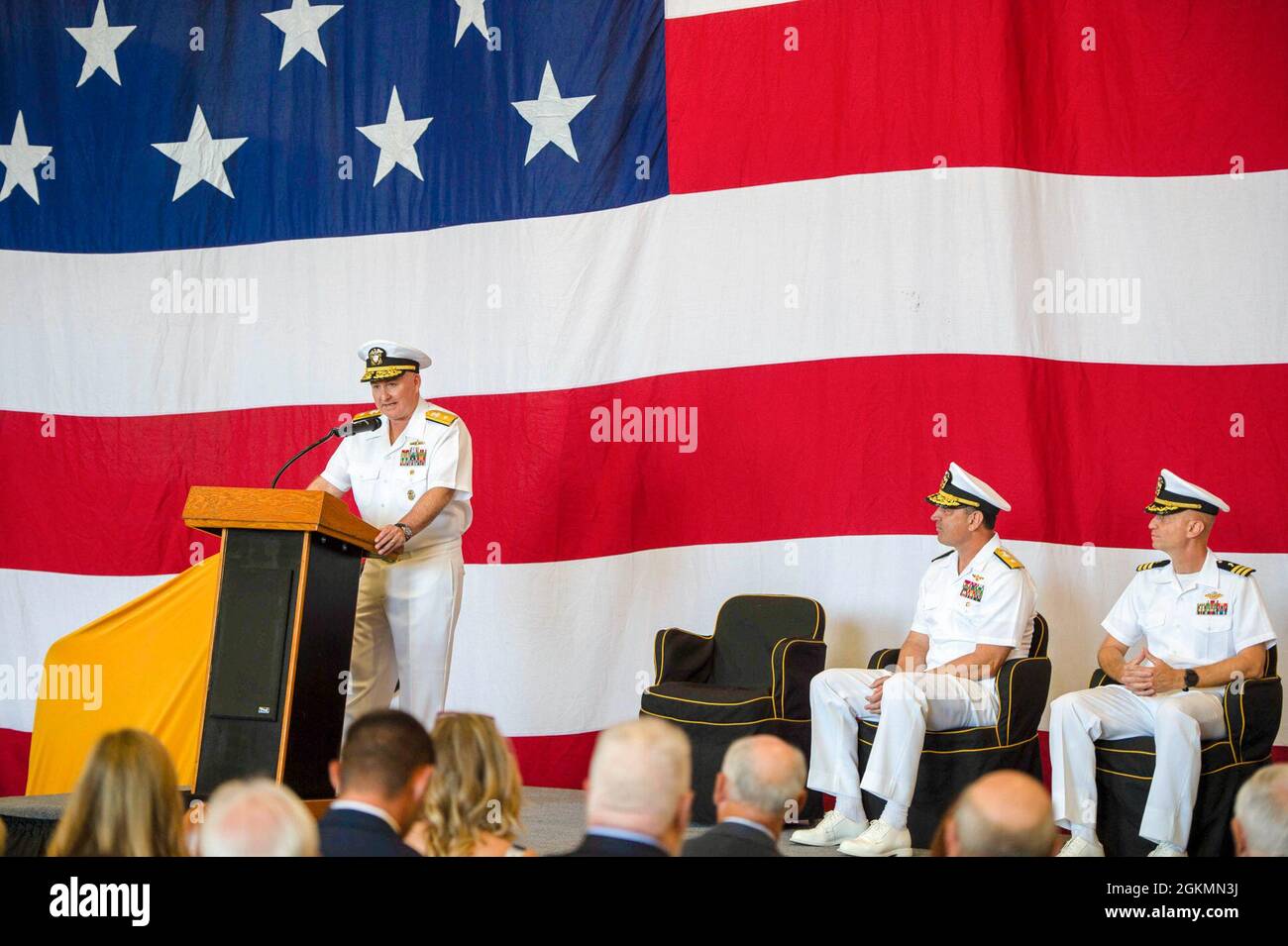 210528-N-IW069-1079 SAN DIEGO (May 28, 2021) Rear Adm. Timothy Kott, Commander, Carrier Strike Group ONE, delivers remarks during a change of command ceremony, May 28, 2021. Carrier Strike Group ONE leads the Carl Vinson Carrier Strike Group with a team of ships, aircraft, and more than 60,000 Sailors, capable of carrying out missions around the globe. Vinson is currently pier side in its homeport of San Diego. Stock Photo