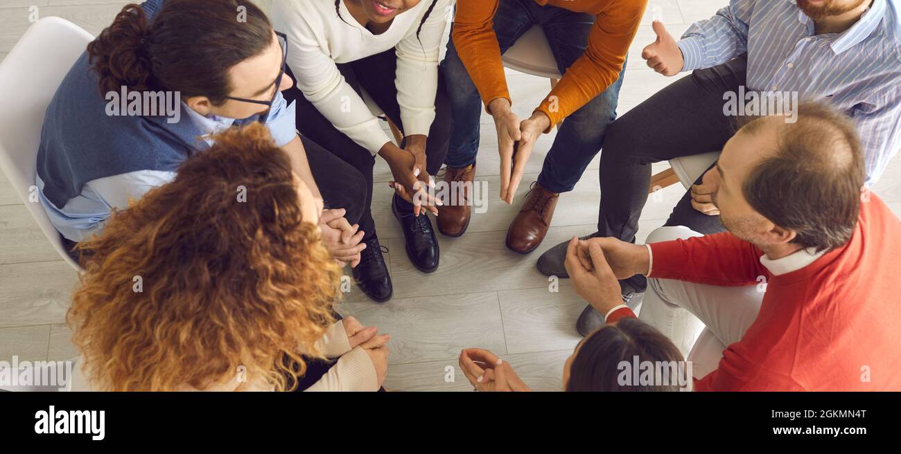 Banner with diverse group of people communicating in therapy session or business meeting Stock Photo