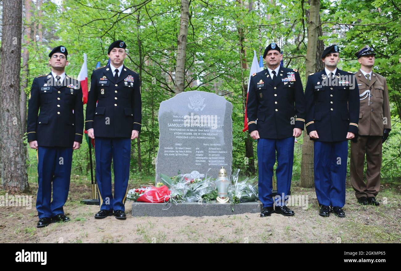 Soldiers from the Florida Guard’s 50th Regional Support Group and a representative of the Polish army attend a remembrance ceremony for the aircrew of the “Popcorn Fort” near Drawsko Pomorskie, Poland, on May 29, 2021. The “Popcorn Fort,” an American B-17 bomber, crashed at this site after getting shot down in 1944 during World War II. Six crew members escaped the crash to become prisoners of war, and three crew members died. Stock Photo