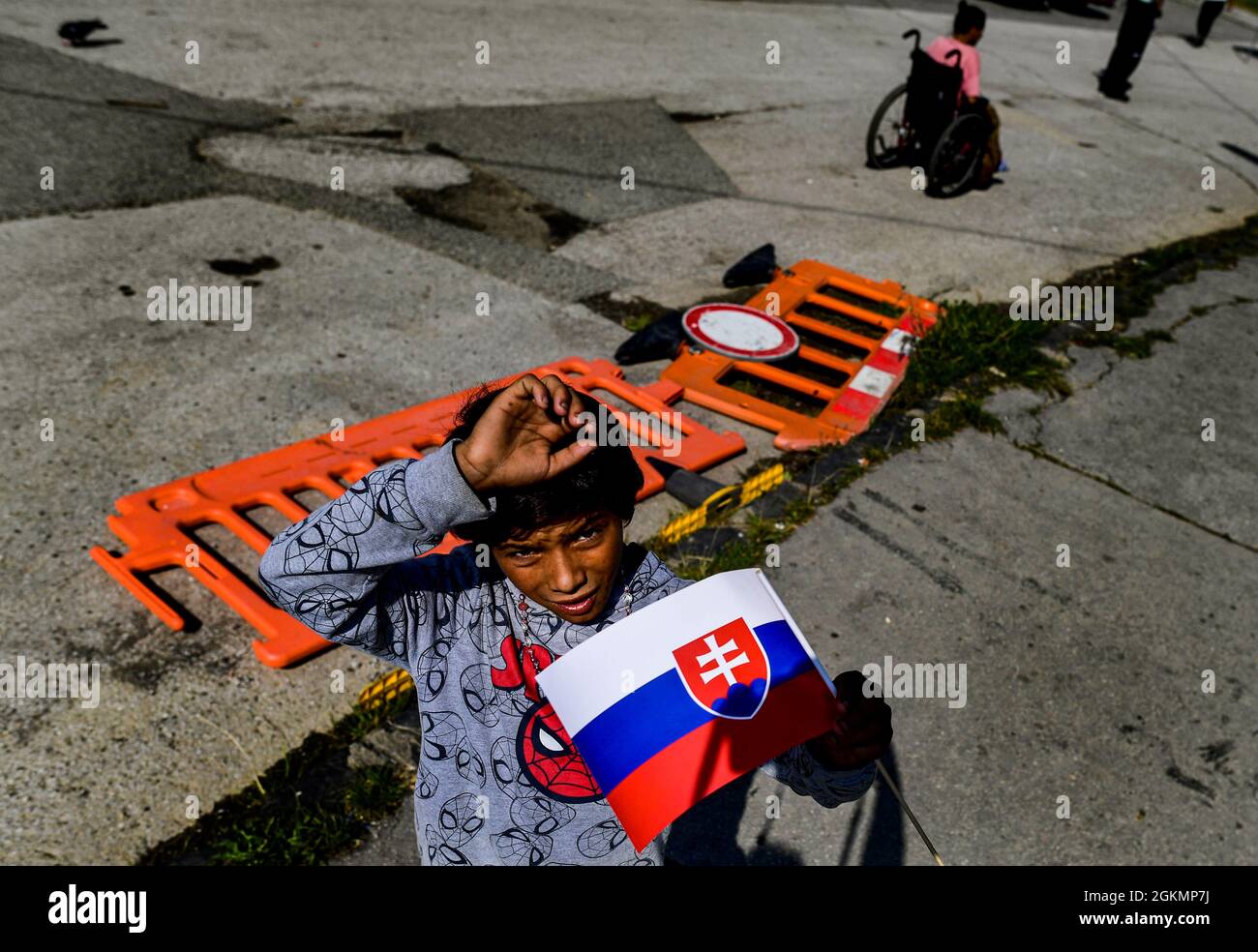 Kosice, Slovakia. 14th Sep, 2021. Boy with Slovak flag waits for Pope Francis arrival to meet members of the Roma community at Slovak Roma housing estate Lunik IX in Kosice, Slovakia, September 14, 2021, during his four-day visit to Slovakia, which started on Sunday. Credit: Roman Vondrous/CTK Photo/Alamy Live News Stock Photo