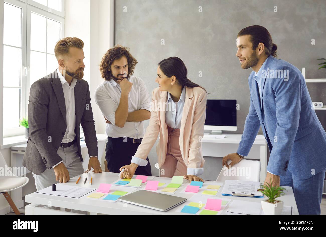 Team of creative business people brainstorming and discussing ideas in work meeting Stock Photo