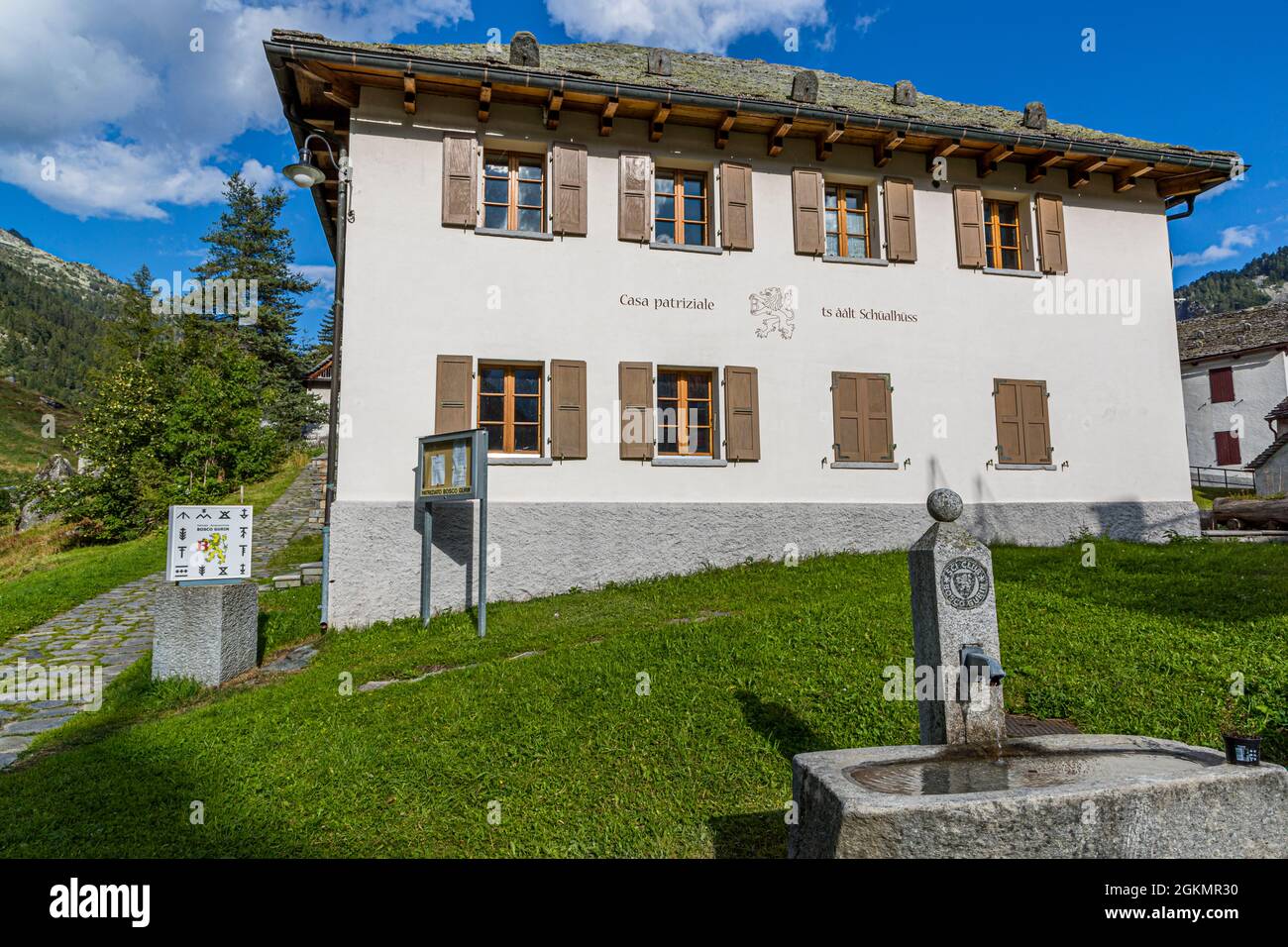 At the parish hall of Bosco Gurin there is a plaque with the 12 symbols of the local families, Circolo della Rovana, Switzerland Stock Photo