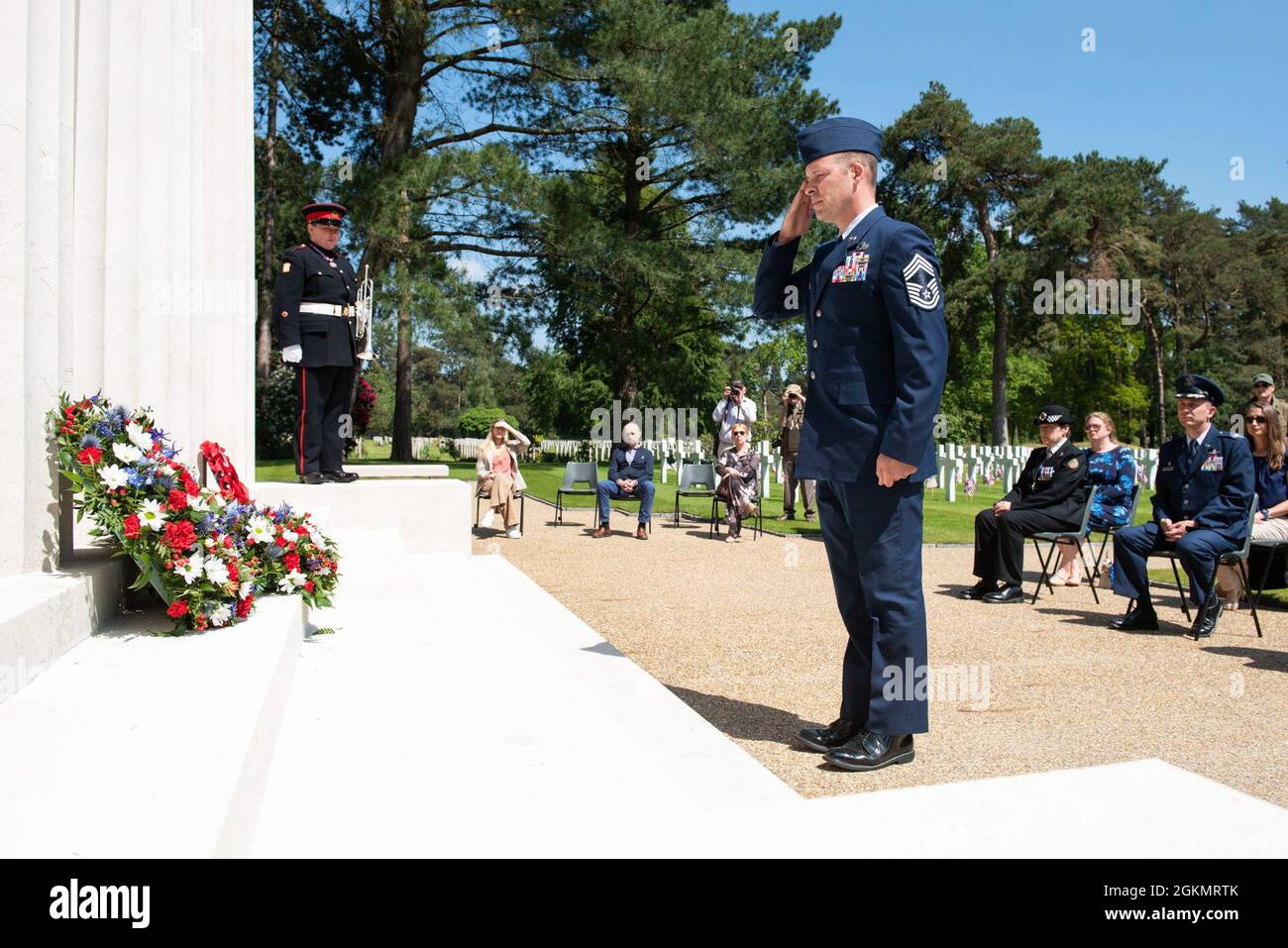 U.S. Air Force Chief Master Sgt. Michael Venning, 422nd Air Base Group superintendent, salutes at a 2021 Memorial Day ceremony at the Brookwood American Military Cemetery, England, May 30, 2021. Memorial Day is one of our Nation's most solemn occasions. It serves as a chance to pause, reflect, and honor the women and men who gave the last full measure defending our Nation and our democratic ideals. Stock Photo