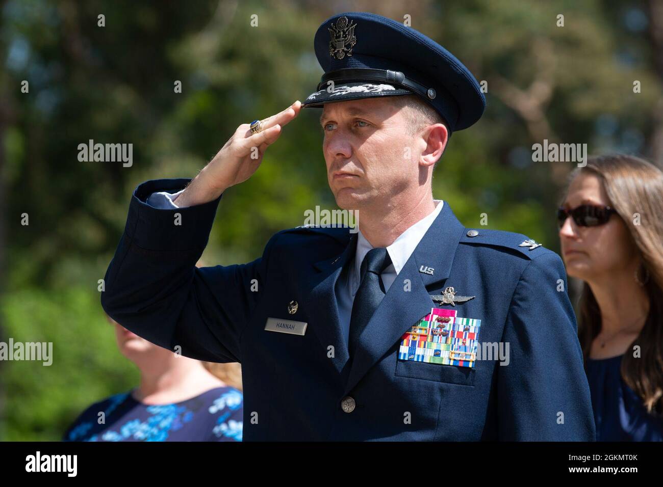 U.S. Air Force Col. Jon Hannah, 422nd Air Base Group commander, salutes at a 2021 Memorial Day ceremony at the Brookwood American Military Cemetery, England, May 30, 2021. Memorial Day is one of our Nation's most solemn occasions. It serves as a chance to pause, reflect, and honor the women and men who gave the last full measure defending our Nation and our democratic ideals. Stock Photo