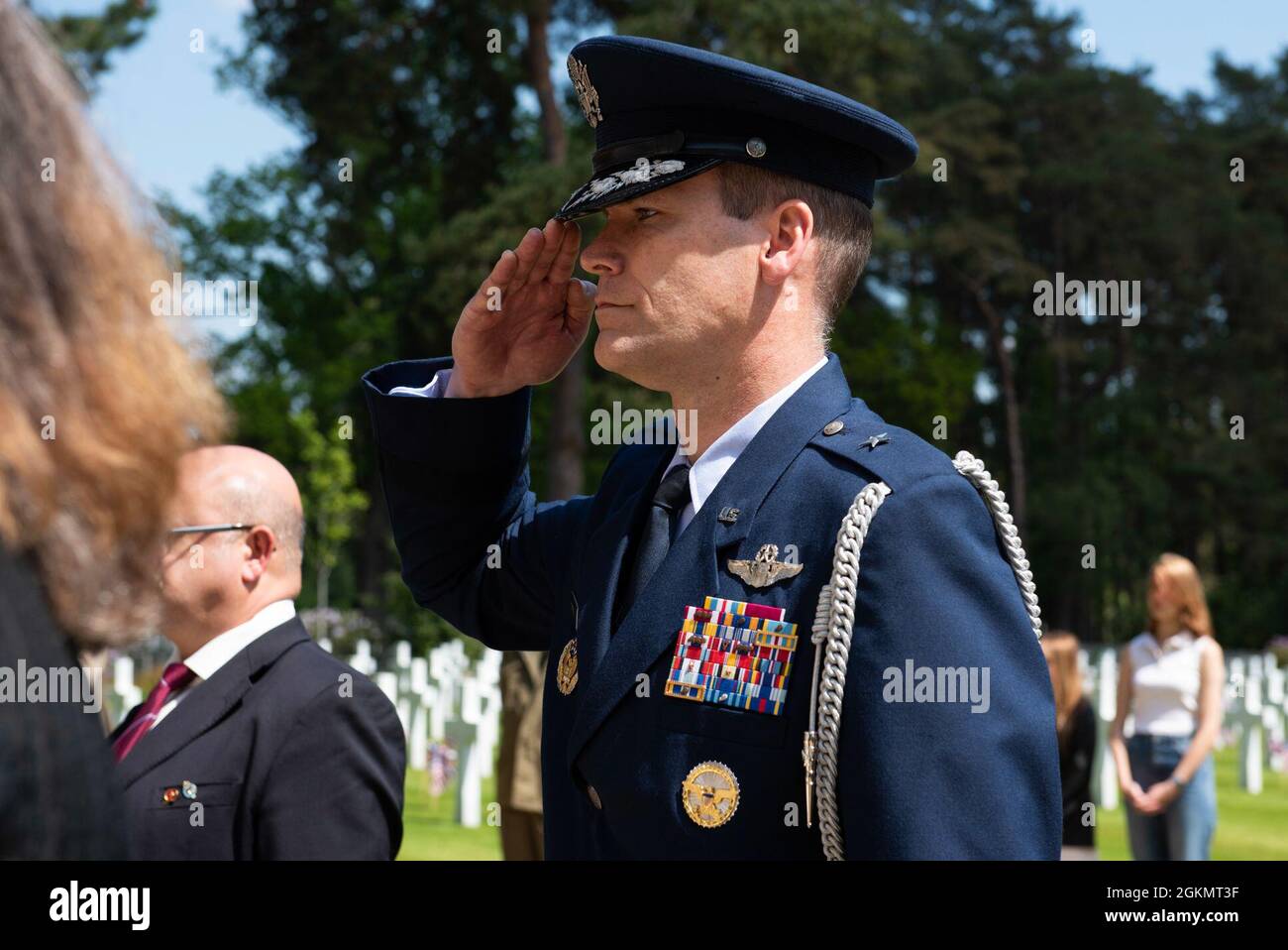 U.S. Air Force Brig. Gen. Jefferson J. O'Donnell, U.S. European Command senior defense official and defense attaché, salutes at a 2021 Memorial Day ceremony at the Brookwood American Military Cemetery, England, May 30, 2021. Memorial Day is one of our Nation's most solemn occasions. It serves as a chance to pause, reflect, and honor the women and men who gave the last full measure defending our Nation and our democratic ideals. Stock Photo