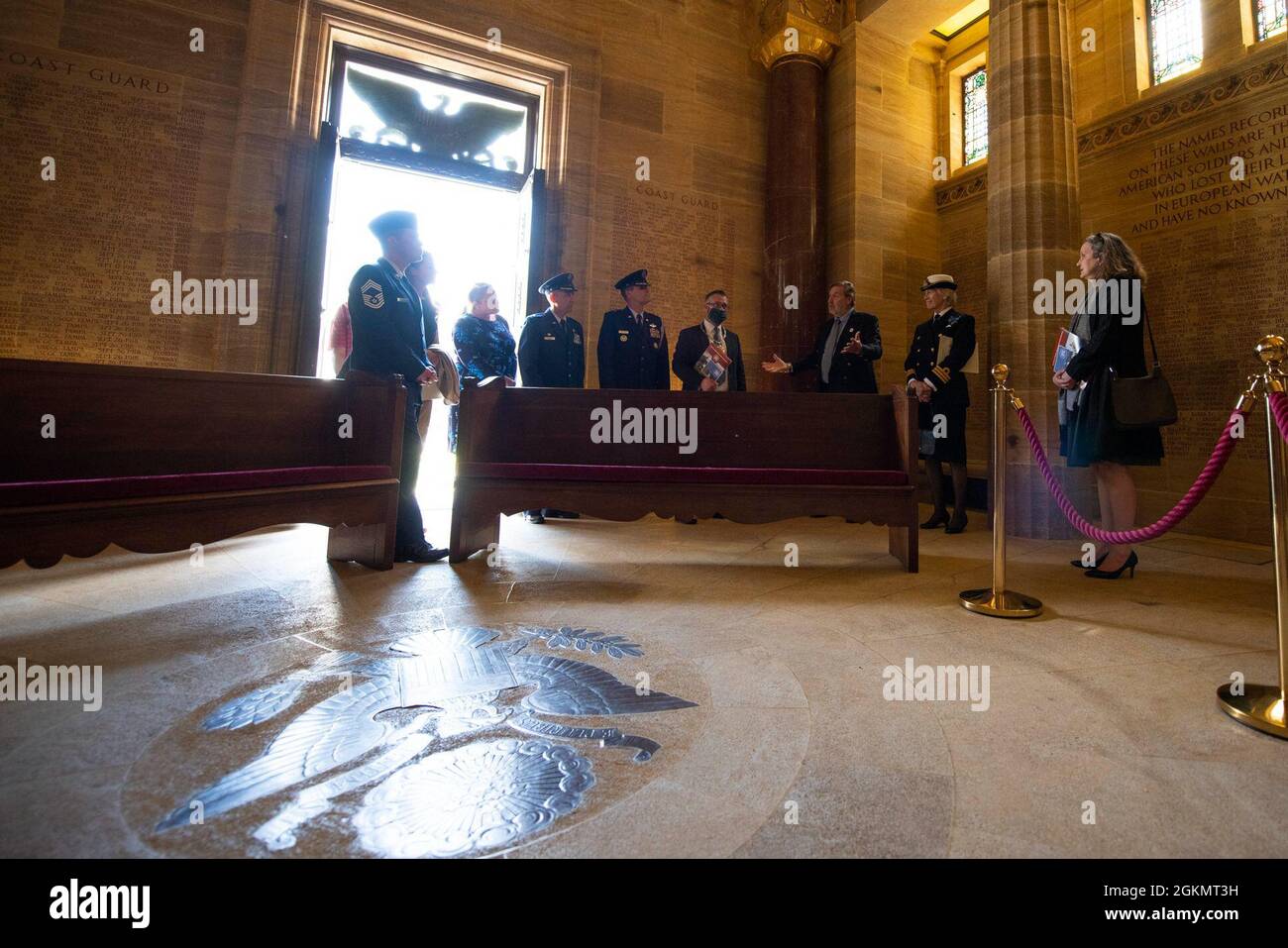 Angelo Munsel, center, Brookwood American Military Cemetery superintendent, provides a tour of the chapel during a 2021 Memorial Day ceremony at the Brookwood American Military Cemetery, England, May 30, 2021. Memorial Day is one of our Nation's most solemn occasions. It serves as a chance to pause, reflect, and honor the women and men who gave the last full measure defending our Nation and our democratic ideals. Stock Photo