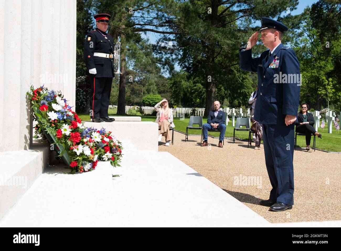 U.S. Air Force Col. Jon Hannah, 422nd Air Base Group commander, salutes at a 2021 Memorial Day ceremony at the Brookwood American Military Cemetery, England, May 30, 2021. Memorial Day is one of our Nation's most solemn occasions. It serves as a chance to pause, reflect, and honor the women and men who gave the last full measure defending our Nation and our democratic ideals. Stock Photo