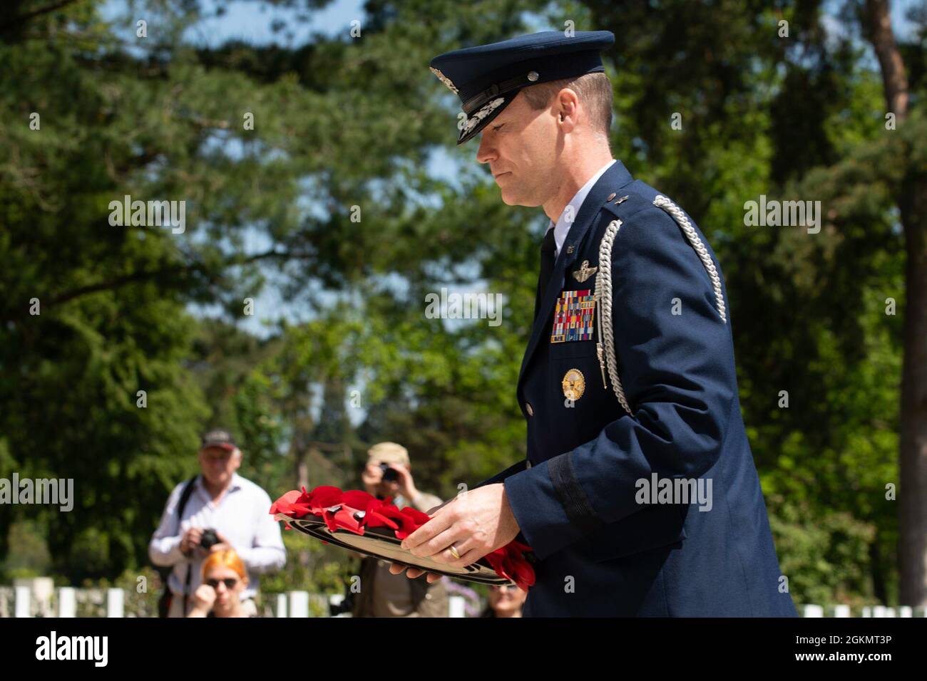 U.S. Air Force Brig. Gen. Jefferson J. O'Donnell, U.S. European Command senior defense official and defense attaché, lays a memorial wreath at a 2021 Memorial Day ceremony at the Brookwood American Military Cemetery, England, May 30, 2021. Memorial Day is one of our Nation's most solemn occasions. It serves as a chance to pause, reflect, and honor the women and men who gave the last full measure defending our Nation and our democratic ideals. Stock Photo