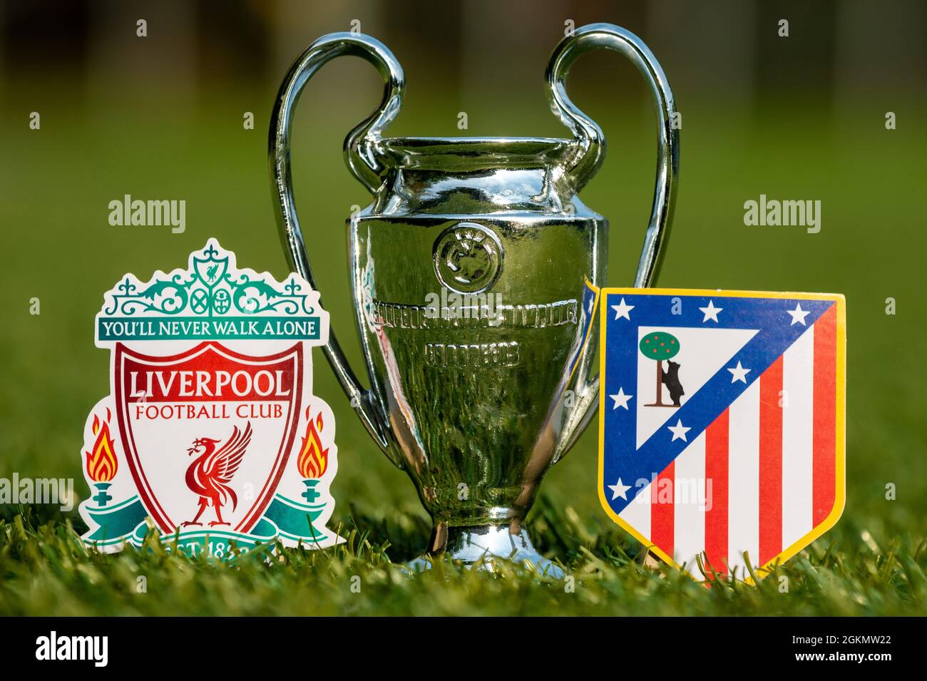 August 27, 2021 Liverpool, UK. The emblems of the Liverpool F. C. and  Atletico Madrid football clubs and the UEFA Champions League Cup on the  green tu Stock Photo - Alamy