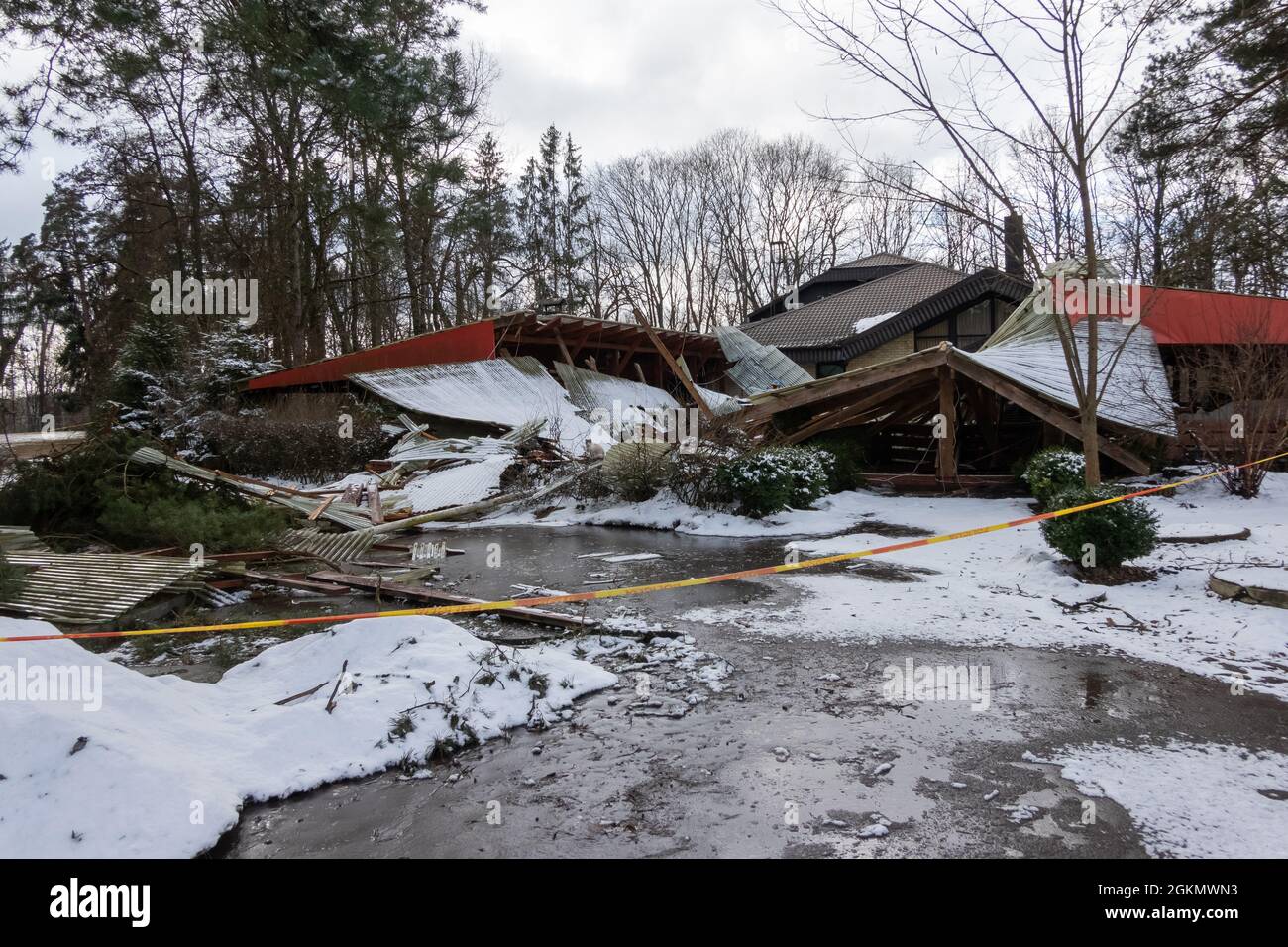 Collapsed roof of an old wooden building. Abandoned architecture, ruins ...