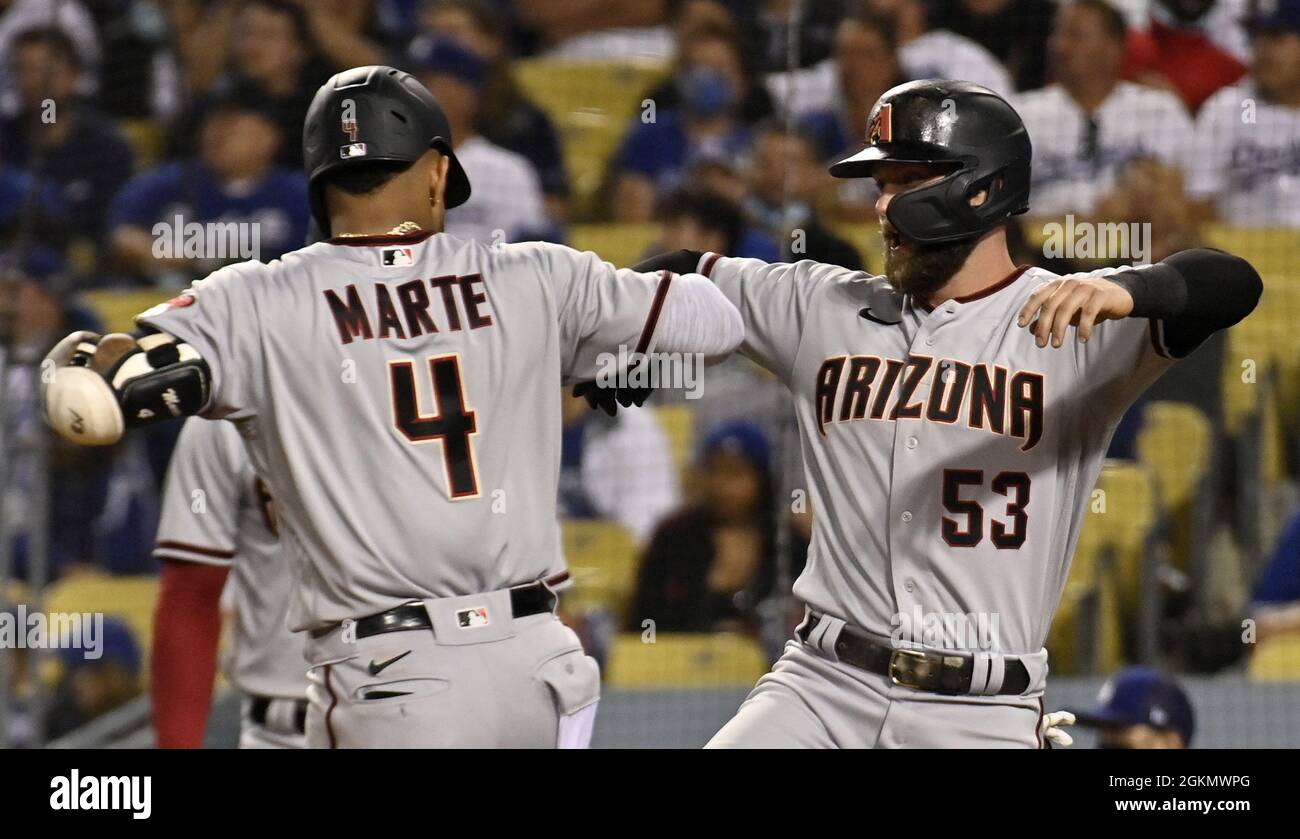 Los Angeles, United States. 15th Sep, 2021. Arizona Diamondbacks' Ketel Marte (4) celebrates with teammate Christian Walker (53) after hitting a three-run home run in the seventh off Los Angeles Dodgers' reliever Justin Bruihi at Dodger Stadium in Los Angeles on Tuesday, September 14, 2021. Marte's 12th home run of the season was the first home run Bruihl has given up at the major-league level. Photo by Jim Ruymen/UPI Credit: UPI/Alamy Live News Stock Photo